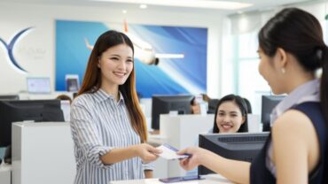 Happy customer at a Hoa Binh travel agency.