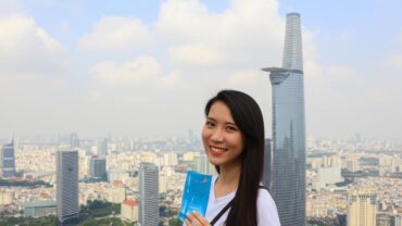 Woman books flight tickets in Thủ Đức city.